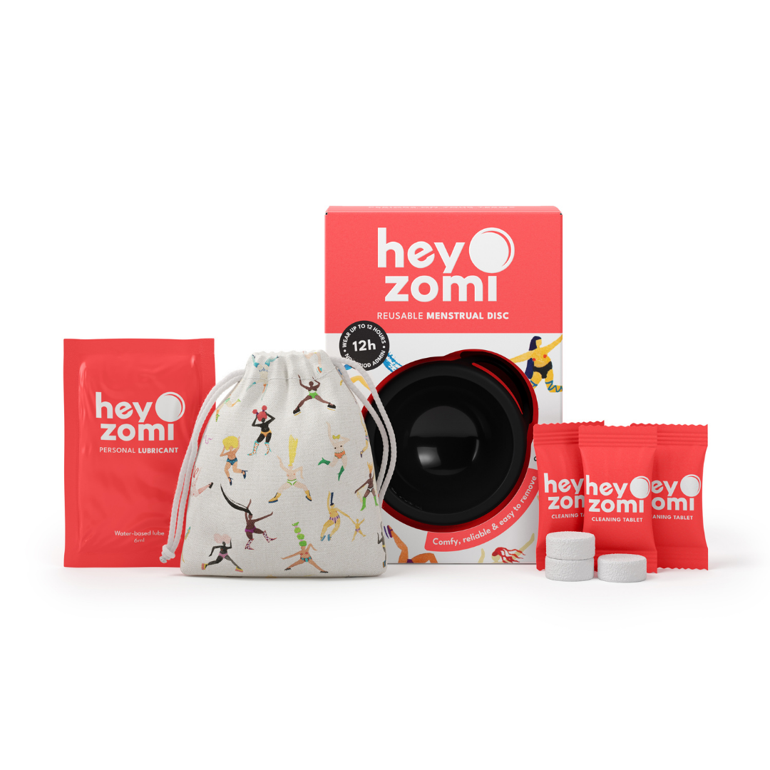 Hey Zomi black menstrual disc packaging with a cute carry bag, free cleaning tablets and free water-based lubricant.