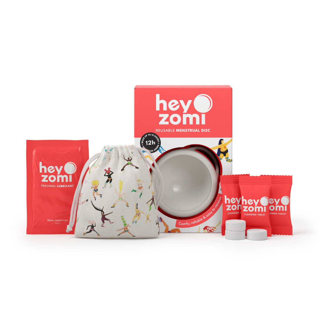 Hey Zomi white menstrual disc packaging with a cute carry bag, free cleaning tablets and free water-based lubricant.