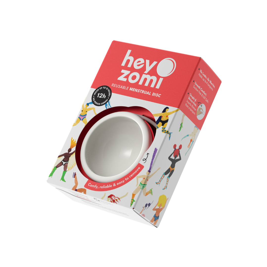 Hey Zomi menstrual disc packaging with a white disc inside on a white background