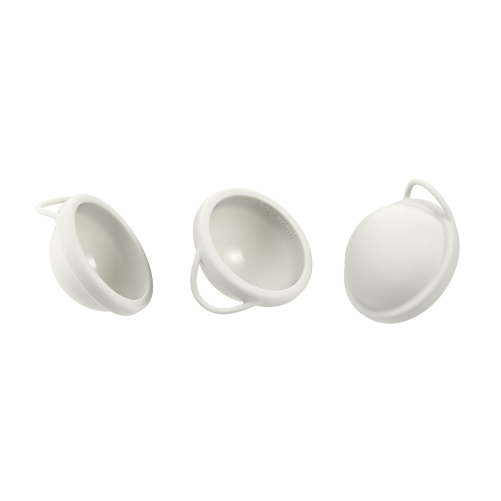 
                  
                    Three white hey zomi discs showing different angles, and the easy removal handle.
                  
                